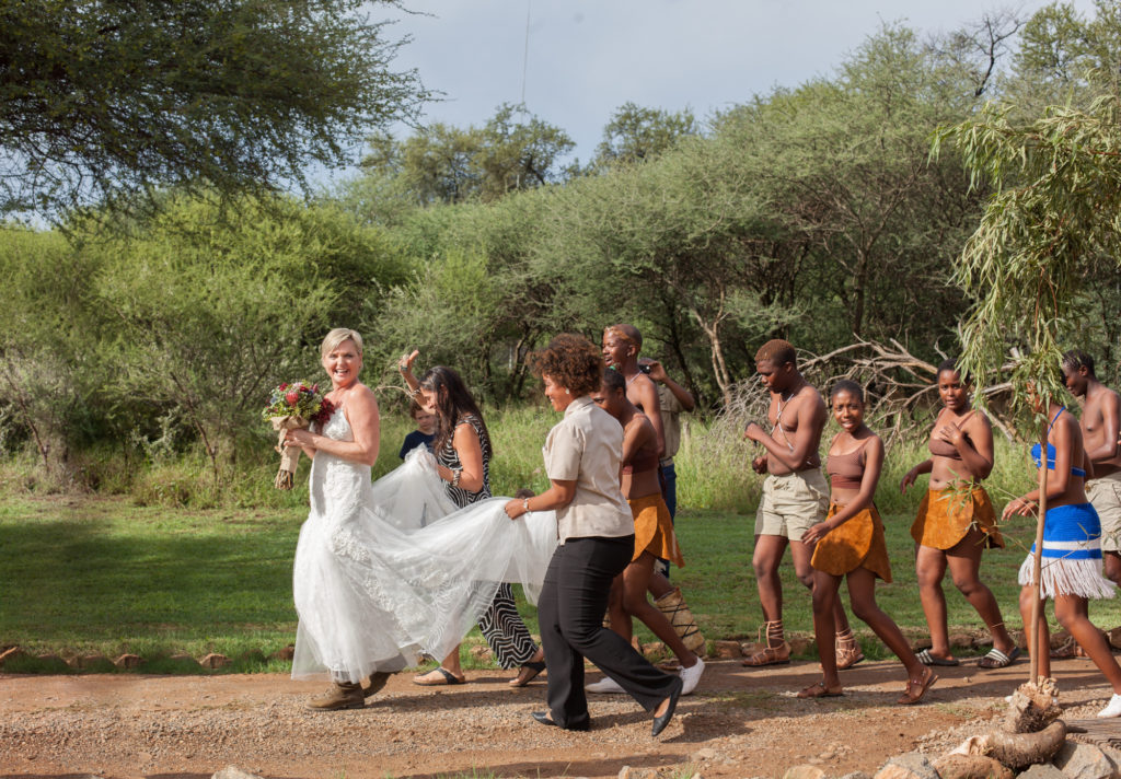 Bride leads a parade of South African dancers